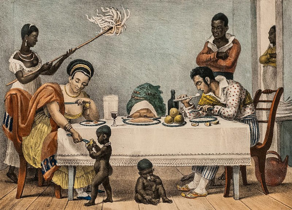 Pintura “O Jantar”, de Debret, mostrando uma cena tradicional colonial brasileira, normalizando a escravidão no Brasil.